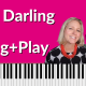 hot pink background with piano keyboard on the bottom. Photo of Brenda Earle Stokes and black and white photo of Paul McCartney. White letters say Oh! Darling Sing and Play